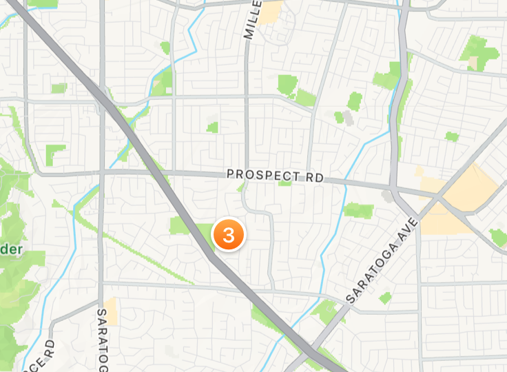 A screenshot of a single pin with the number three, representing a cluster of three points of interest that are within close proximity.