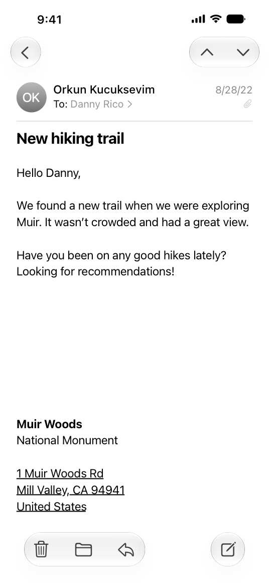 A screenshot of a Mail message on iPhone, using the default font size. From the left, the message header displays the sender's contact photo or initials, followed by a two-line layout with the sender name and date on top and the recipient name and attachment glyph on the bottom. The message body contains four lines of text and the address of Muir Woods National Monument.